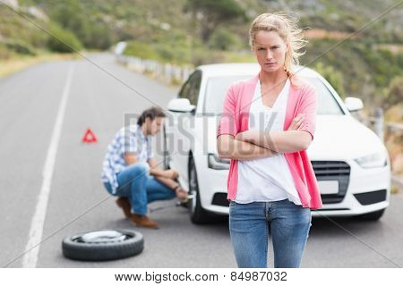 Couple after a car breakdown at the side of the road