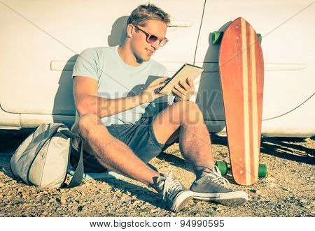 Young Hipster Man With Tablet Sitting Next His Car - Concept Of Modern Technologies