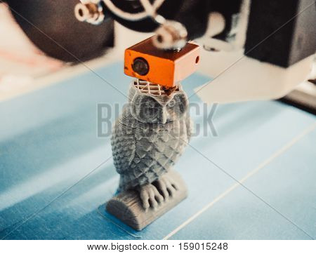 HD 1080 3D printer prints, creates, pouring, yellow a figure, shape of plastic, close-up. 3D printer prints red shapes on a red background