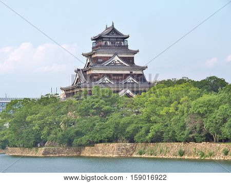 Hiroshima Castle on the side of Otagawa river in summer. The castle was destroyed by the atomic bombing on August 6, 1945 but was rebuilt in 1958.