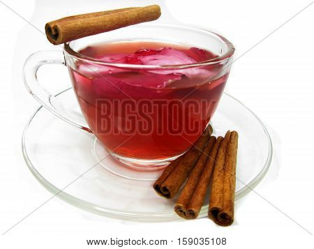 rose tea punch cocktail in jug and cup with cinnamon