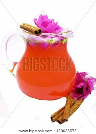 rose punch tea cocktail punch in jug with cinnamon sticks