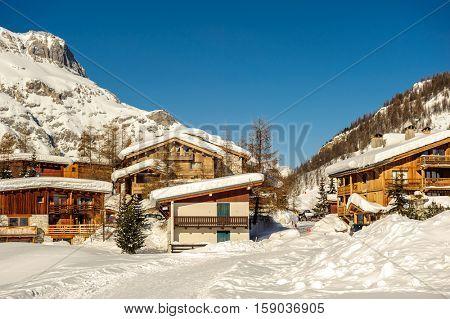 Alpine winter mountain landscape. French Alps covered with snow in sunny day. Val-d'Isere, France