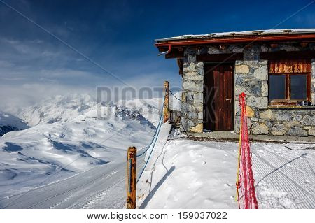 Alpine winter mountain landscape. French Alps covered with snow in sunny day. Val-d'Isere, France