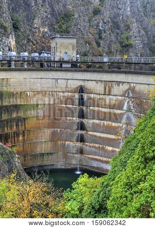 Water falls from the dam of hydroelectric power plant