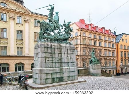 STOCKHOLM, SWEDEN - APRIL 11, 2010: Saint Göran (Saint George) and the Dragon Statue - bronze replica of Bernt Notke Sculpture. Located on Kopmantorget Square in Gamla Stan (Old Town).
