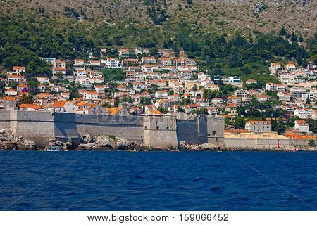 The Walls of Dubrovnik defensive stone walls surrounded Old Town Dubrownik Croatia.