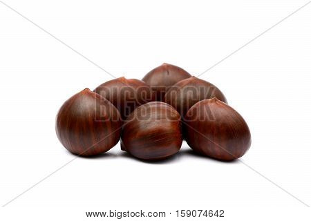 Fresh brown chestnuts isolated on white background