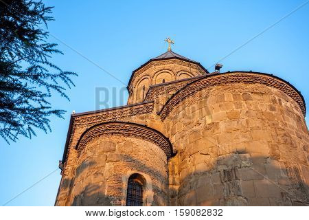 View Metekhi Church in the morning above the Kura river in Tbilisi Georgia.