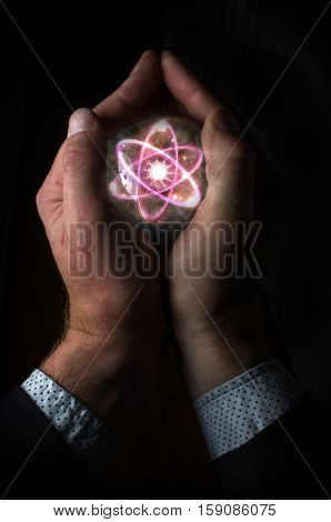 Holding atom in fortune teller magic crystal ball