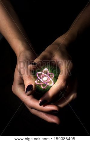 Holding atom in fortune teller magic crystal ball
