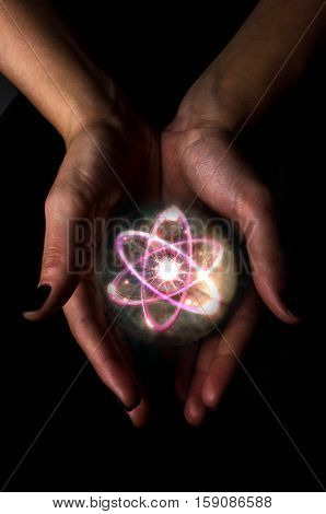 Holding atom in fortune teller magic crystal ball
