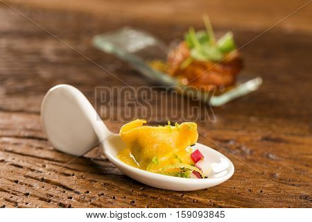 Shrimp Tortelline, Morning Gravy, Radish And Black Salt  In A Spoon. Taste Gastronomy Fingerfood