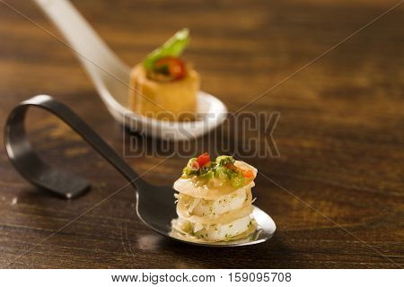 Thousand Leaves Stuffed With Cod Vinaigrette And Heart Of Palm In A Spoon. Taste Gastronomy Finger F