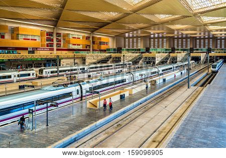 Zaragoza, Spain - October 9, 2016: High-speed and regional trains at Zaragoza-Delicias station