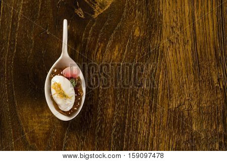 Natural Flavored Mint Yogurt, Pepper Sago Finished With Caramel In A Spoon. Taste Gastronomy Finger