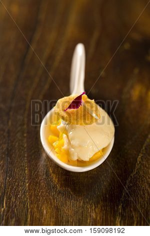 Baru Ice Cream With Chopped Mango And Cornmeal In A Spoon. Taste Gastronomy Finger Food