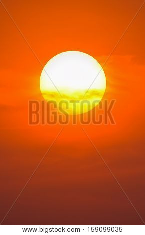 Summer Sunset. The Setting Sun In A Cloudy Sky Background