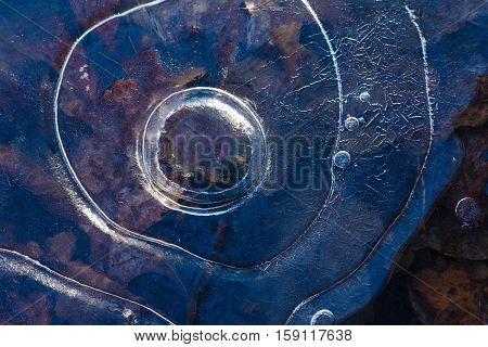 Ice pattern background on the surface of the pond or river. Macro frost crystal winter design