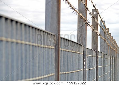 Steel anti entry fence with sharp spikes.