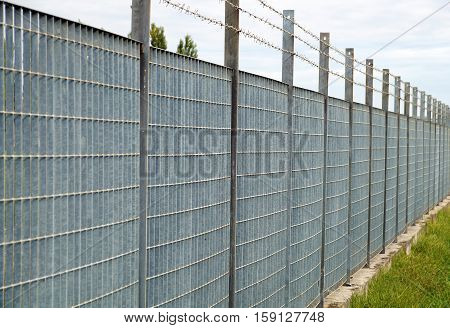 Steel anti entry fence with sharp spikes.