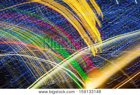 Abstract background made of Christmas lights with long exposure.