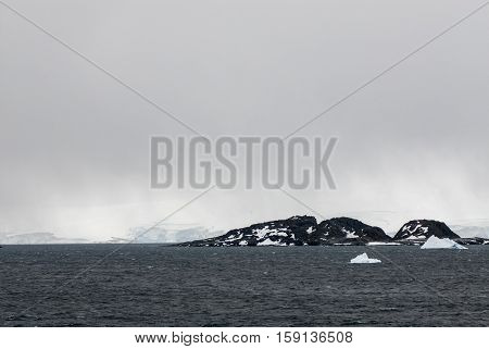 Antarctica in a cloudy day- Antarctic Peninsula - Palmer Archipelago - Neumayer Channel - Global warming - Fairytale landscape