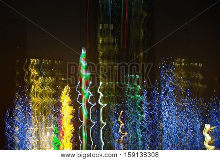Abstract background made of Christmas lights with long exposure.