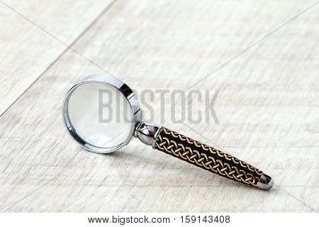 Stationery Magnifier On A Grey Background