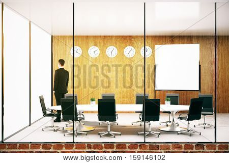 Thoughtful young businessman in modern conference roon with blank whiteboard. Mock up 3D Rendering