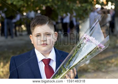 the teenager the school student for September 1 with flowers a subject children and holidays school on September 1