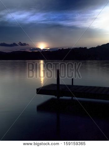 Dock on Squam Lake in New Hampshire at sunset