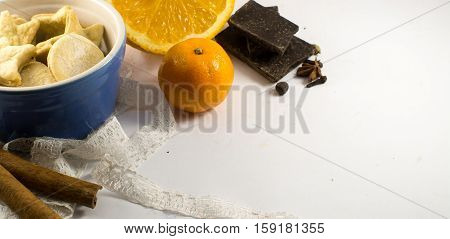 biscuits spices and chocolade on the white backgraund