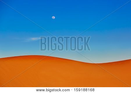 Sand Dunes And Almost Full Moon