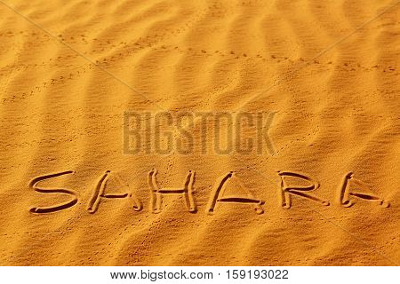 Word Sahara Written On The Sand