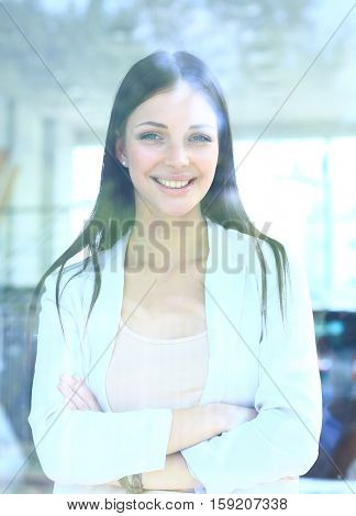 business woman looking thtough window in the office