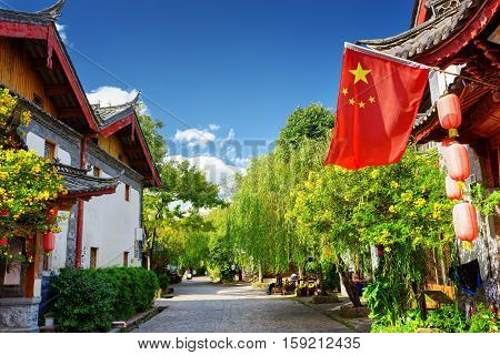 The Flag Of China In The Old Town Of Lijiang, China