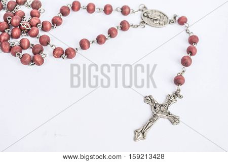 Close-up a rosary on isolated white background