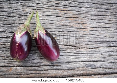 Group of eggplant on old wood background