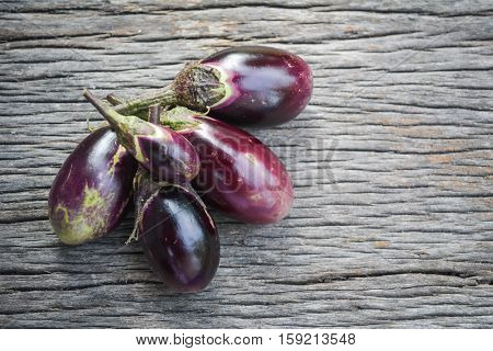 Group of eggplant on old wood background
