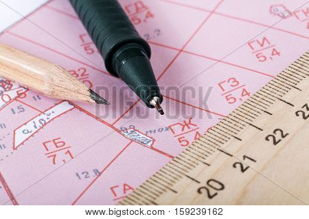 Topographic map of district with ruler and a pencil