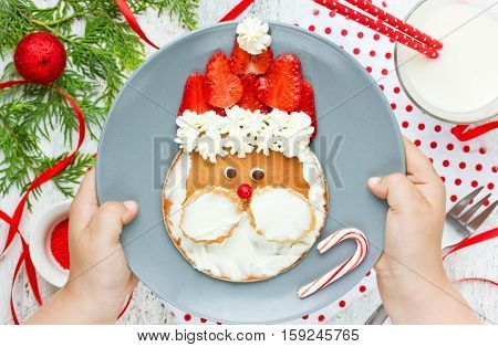 Santa pancake - Christmas breakfast idea for kids adorable pancake with strawberry and whipped cream