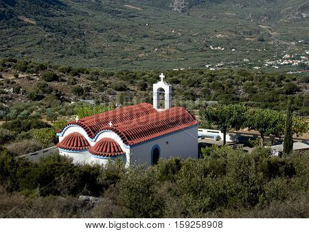 little white church with a red roof. Dikti Mountains. Crete. Greece