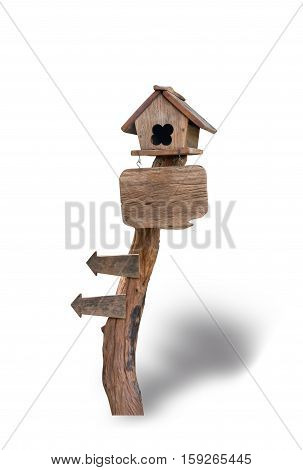 Wooden bird house on wooden sign isolated on white background. File contains a clipping path.