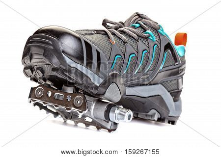 Closeup of cycling shoes with pedal attached to the sole isolated on white background.