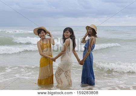 younger asian woman friend relaxing vacation time at sea beach happiness emotion