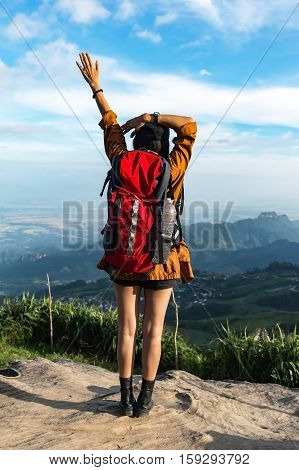 Hiker woman feeling victorious facing on the mountain Thailand