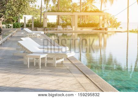 Relax Sun-beds Near A Swimming Pool