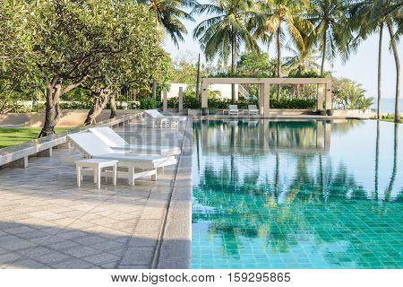 Relax Sun-beds Near A Swimming Pool