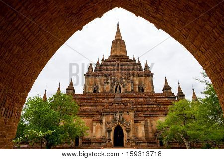 Architectural detail of a temple in Bagan with stone arch entrance Myanmar
